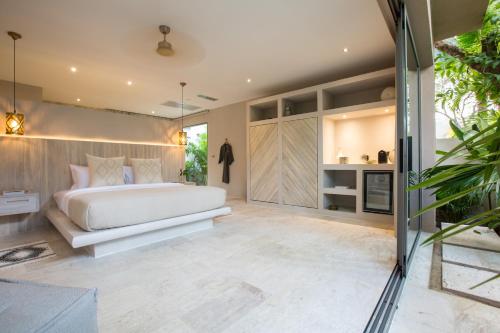 a bedroom with a white bed in a room at Cielo Boutique Hotel & Spa Samui in Bophut 