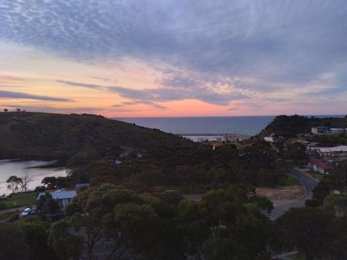 a view of the ocean from a hill at sunset at Belle Vista in Wirrina Cove
