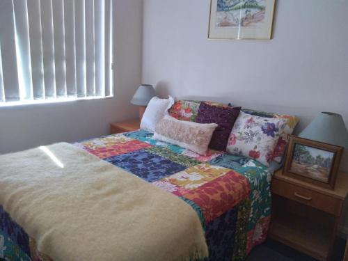 Un pat sau paturi într-o cameră la Belle Vista
