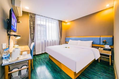 Ένα ή περισσότερα κρεβάτια σε δωμάτιο στο Home Inn Changsha Railway Station Bayi Road