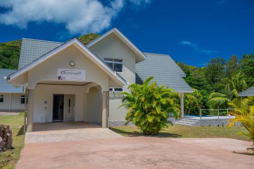 a house with a driveway in front of it at Tranquility villas in Baie Sainte Anne