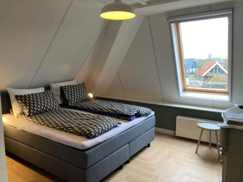 Postel nebo postele na pokoji v ubytování Hotel Workum