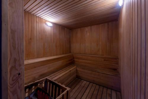 an empty sauna with wooden paneling and lights at Armas Green Fugla Beach in Avsallar