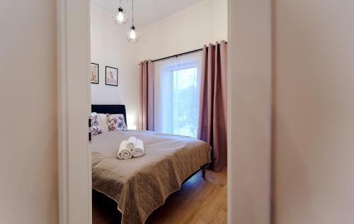 En eller flere senge i et værelse på LAGUNA Apartament Polanica Residence 54