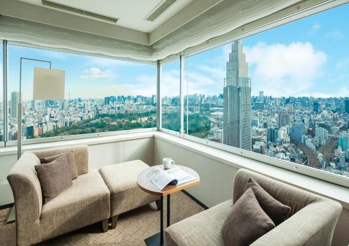 a room with a view of a city at Odakyu Hotel Century Southern Tower in Tokyo