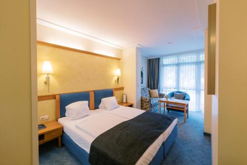 Postel nebo postele na pokoji v ubytování Hotel Locker & Legere