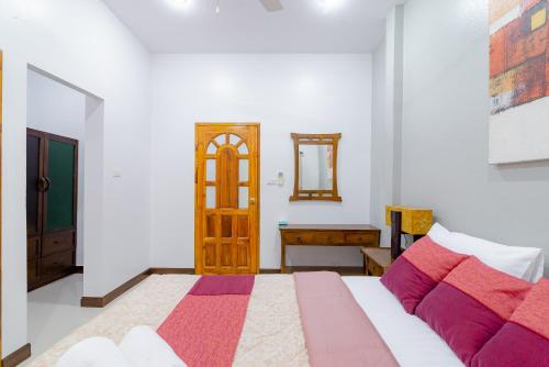 Postel nebo postele na pokoji v ubytování Bangsaphan Paradise Bankrut Vanilla Villa