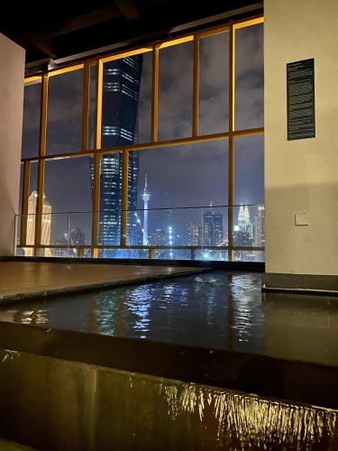a view of a city skyline from a building at Opus Residence KL by EUcation Home in Kuala Lumpur