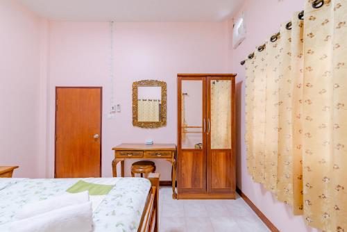 Ένα ή περισσότερα κρεβάτια σε δωμάτιο στο Bangsaphan Paradise Green House