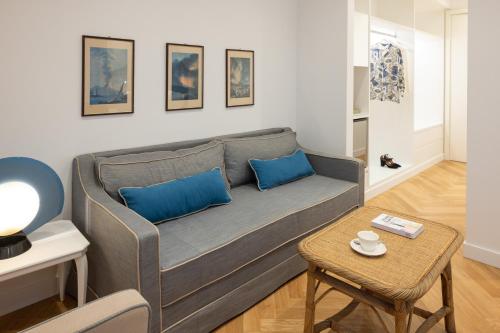 a living room with a couch and a table at Hotel Morfeo in Milan