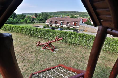 an aerial view of a farm with a building at Margaréta Apartman és Üdülőház in Bogács