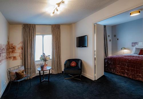 Postel nebo postele na pokoji v ubytování Hôtel Quorum