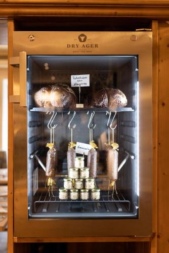 a oven with meat and pastries in it at Der WALZL in Innsbruck