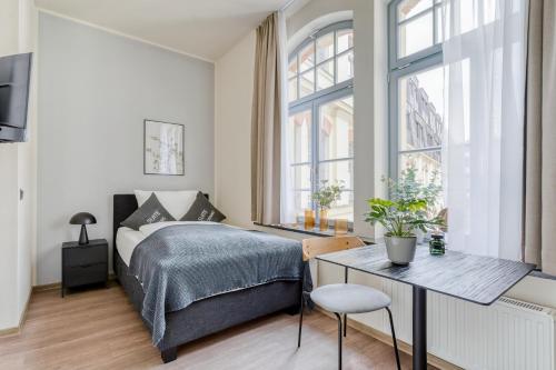 Ένα ή περισσότερα κρεβάτια σε δωμάτιο στο Limehome Leipzig Oelßner's Hof