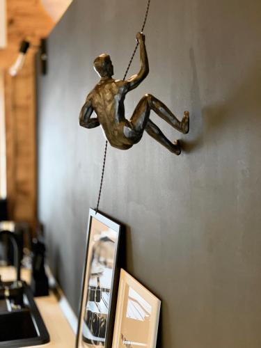 a statue of a man hanging on a wall at Hirschbachwinkel - fewo-badhindelang in Bad Hindelang