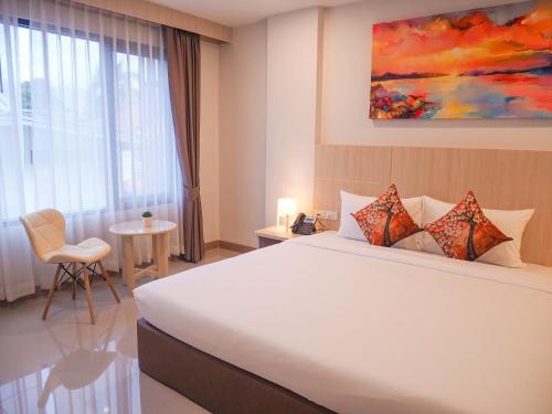 Postel nebo postele na pokoji v ubytování Malee Hotel