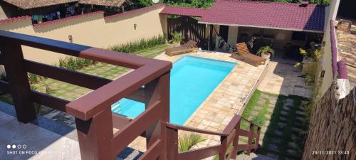a model of a house with a swimming pool at Praia Virgem Hostel in Rio das Ostras