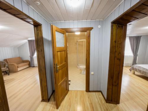 a room with a door leading to a bathroom at Villa Shale MarSo in Bukovel