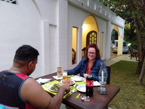 a man and a woman sitting at a table at Ovitiyas Bandarawela in Bandarawela