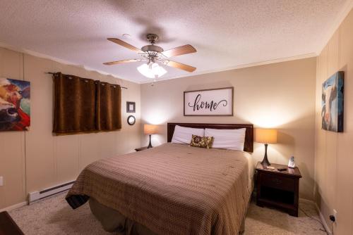 a bedroom with a bed and a ceiling fan at Sunsets at Summit 108b, free WI-FI, parking and AC in Snowshoe