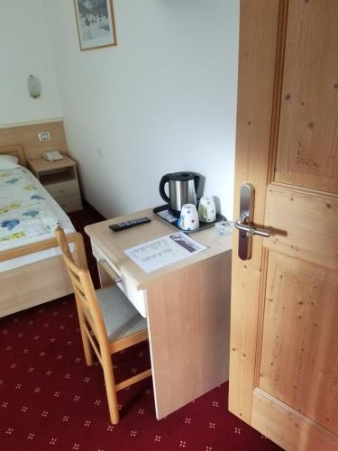 Postel nebo postele na pokoji v ubytování Garni Ciamorc