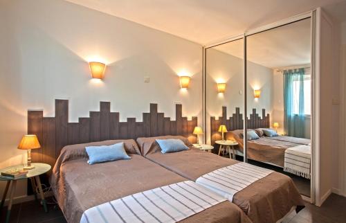 Säng eller sängar i ett rum på Villa Karisma