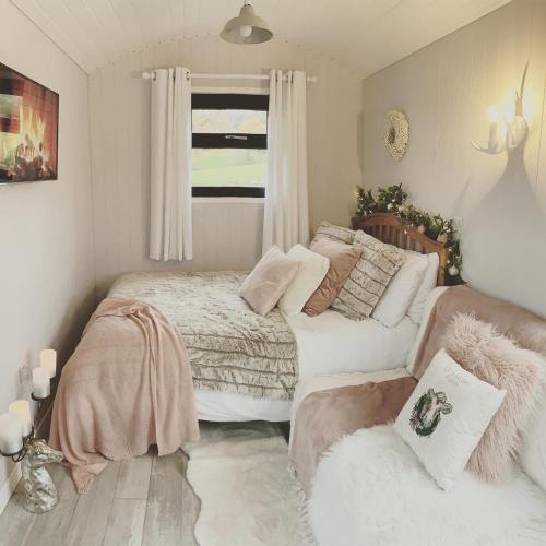 a small bedroom with a bed and a couch at Ribble Valley Retreat in Langho