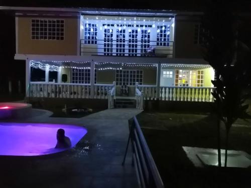 a person in a swimming pool at night at FINCA CORENAS in La Cumbre
