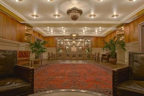 a large lobby with chairs and a waiting room at Soho Grand Hotel in New York