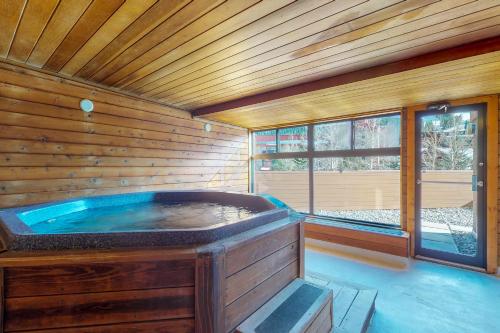 a large wooden room with a jacuzzi tub at West Lake Lodge 309 in Copper Mountain