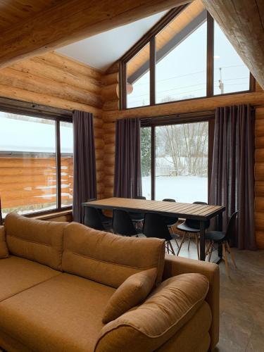 a living room with a couch and a table at 4REST ZRUB in Tukhlya