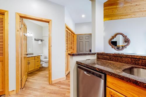 a kitchen with a sink and a mirror at Deer Valley Courchevel Condo in Park City