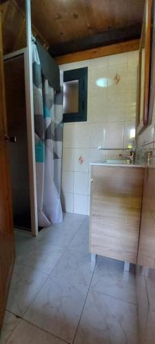 a small kitchen with a sink and a cabinet at Santana Houses - Mountain Shelter bungallows in Santana