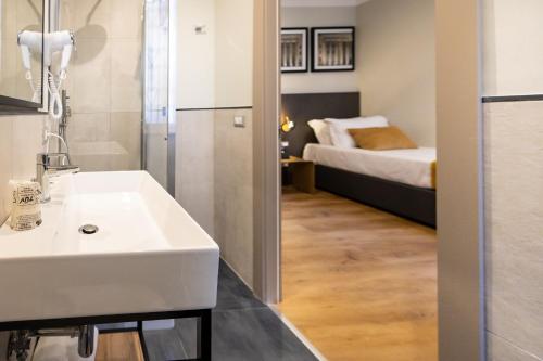 Ένα ή περισσότερα κρεβάτια σε δωμάτιο στο The Cross Hotel