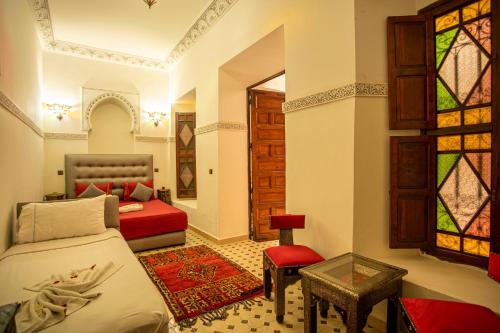Un ou plusieurs lits dans un hébergement de l'établissement Riad Aymane