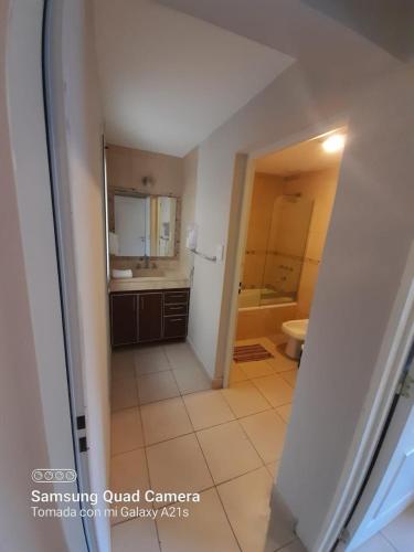 a bathroom with a sink and a toilet in it at Departamentos Giova in Salta
