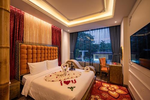 מיטה או מיטות בחדר ב-Mai Hotel
