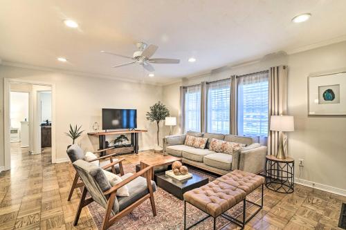 a living room with a couch and a table at Mid-Century Modern Escape in Central Lakeland! in Lakeland