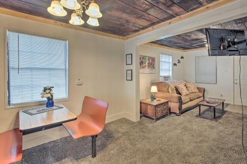 a living room with a couch and a table at Hot Springs Home 2 Mi to Hot Springs Natl Park in Hot Springs