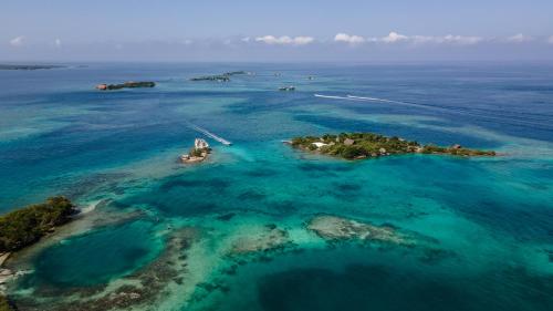 an aerial view of an island in the ocean at Isla Los Erizos EcoHouse in Isla Grande