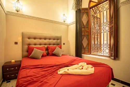 Un ou plusieurs lits dans un hébergement de l'établissement Riad Aymane