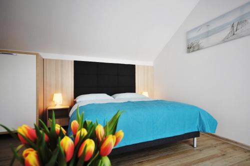 Säng eller sängar i ett rum på Villa Blanca - Apartamenty