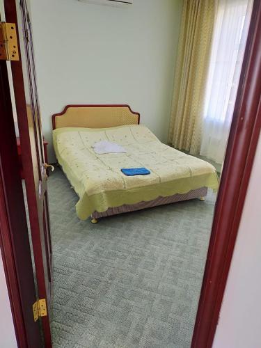 a bedroom with a bed in a room at SULO Bautino Hotel in Bautino