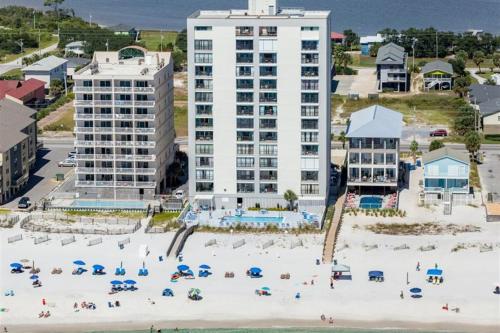 an aerial view of a beach with umbrellas and buildings at Gulf Tower 14W in Gulf Shores