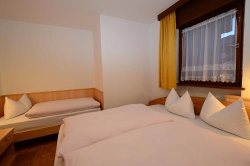Postel nebo postele na pokoji v ubytování Residence Albierch