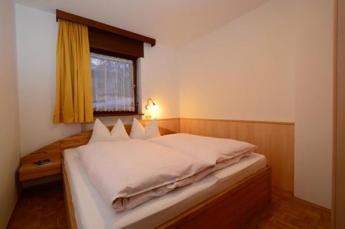 Postel nebo postele na pokoji v ubytování Residence Albierch
