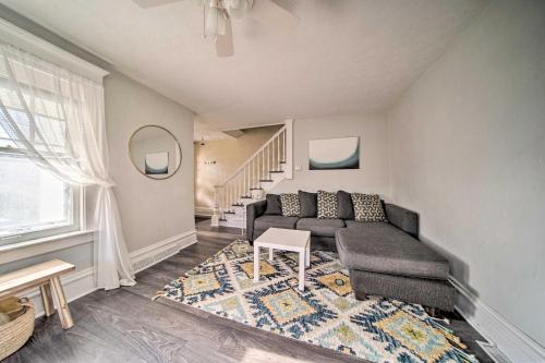 a living room with a couch and a table at Historic Family Home 2 Mi to Lake Erie and Zoo! in Erie