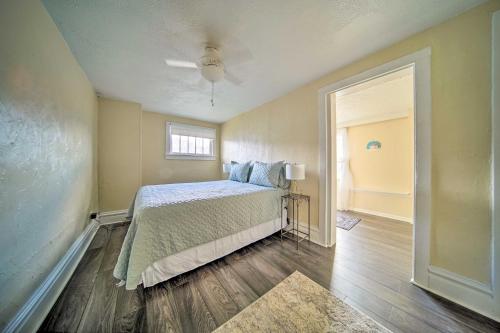 a bedroom with a bed and a window at Historic Family Home 2 Mi to Lake Erie and Zoo! in Erie