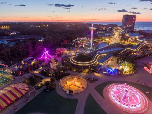 an aerial view of an amusement park at night at Entire apartment with sun filled private garden in Margate