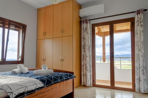 En eller flere senge i et værelse på Vila Palma